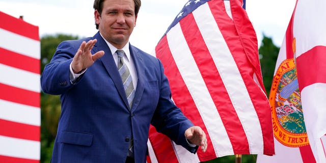 Florida Gov. Ron DeSantis attends an event with President Donald Trump on the environment at the Jupiter Inlet Lighthouse and Museum, Tuesday, Sept. 8, 2020, in Jupiter, Fla. (AP Photo/Evan Vucci)