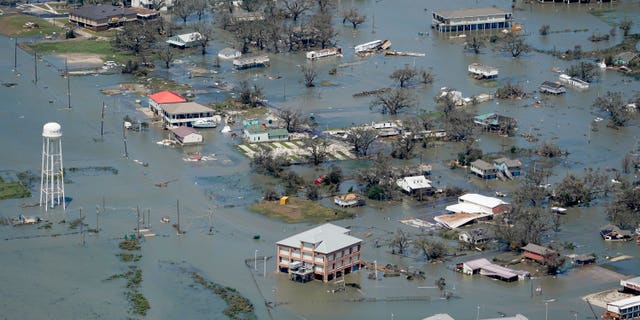 Buildings and homes are flooded after Hurricane Laura near Lake Charles, La. (AP Photo / David J. Phillip, File)