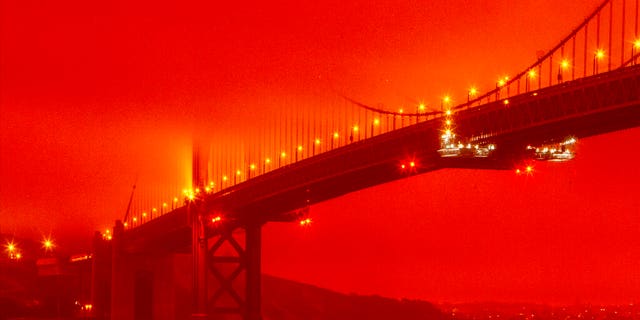 The Golden Gate Bridge at 11 a.m. Wednesday, Sept. 9, 2020, in San Francisco, amid a smoky, orange haze caused by the ongoing wildfires. (Frederic Larson via AP)