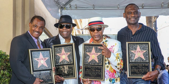 FILE - Robert 'Kool' Bell, from left, Ronald 'Khalis' Bell, Dennis 'DT' Thomas and George Brown attend a ceremony honoring Kool &amp; The Gang with a star on The Hollywood Walk of Fame on Oct. 8, 2015, in Los Angeles. (Photo by Rich Fury/Invision/AP, FILE)