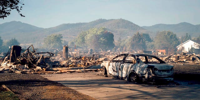 This photo taken by Talent, Ore., resident Kevin Jantzer shows the destruction of his hometown in the aftermath of wildfires that ravaged the central Oregon town near Medford, Sept. 9. (Kevin Jantzer via AP)