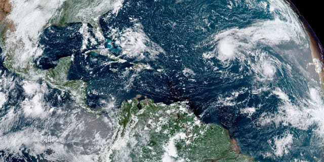 This GOES-16 GeoColor satellite image taken Thursday, Sept. 10, 2020, and provided by NOAA, shows tropical storms forming in the Atlantic. La Nina, which often means a busier Atlantic hurricane season, a drier Southwest and perhaps a more fire-prone California, has popped up in the Pacific Ocean, the National Oceanic and Atmospheric Administration announced Thursday, Sept. 10. (NOAA via AP)