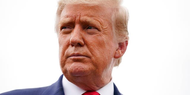 President Donald Trump speaks to the press before boarding Air Force One for a trip to a campaign rally in Freeland, Mich., Sept. 10, in Andrews Air Force Base, Md. (AP Photo/Evan Vucci)