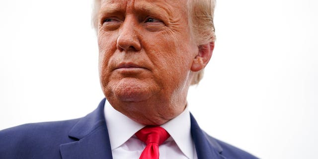 President Donald Trump speaks to the press before boarding Air Force One for a trip to a campaign rally in Freeland, Mich., Sept. 10, in Andrews Air Force Base, Md. (AP Photo/Evan Vucci)