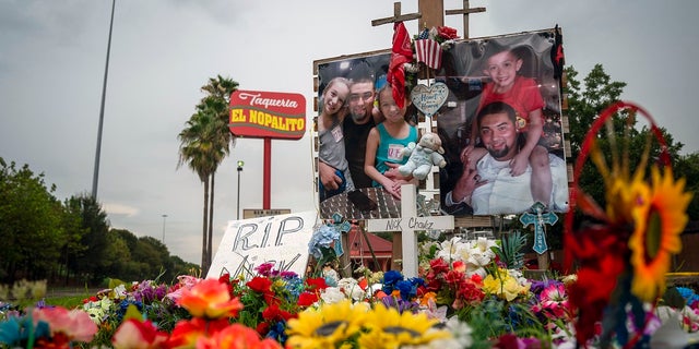 A tribute to Nicolas Chavez, 27, who was shot and killed April 21 by several police officers during a confrontation in Houston's Denver Harbor neighborhood, sits at the site of the shooting along Interstate 10 on Thursday. The officers involved have been fired but are appealing the dismissals. (Mark Mulligan/Houston Chronicle via AP)