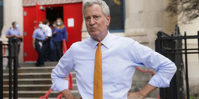 Eric Adams wants NYC to be 'place of God' after predecessor targeted religion throughout pandemic 4 In this Aug. 19, 2020, file photo, then-New York City Mayor Bill de Blasio speaks to reporters after visiting New Bridges Elementary School in the Brooklyn borough of New York, to observe pandemic-related safety procedures.