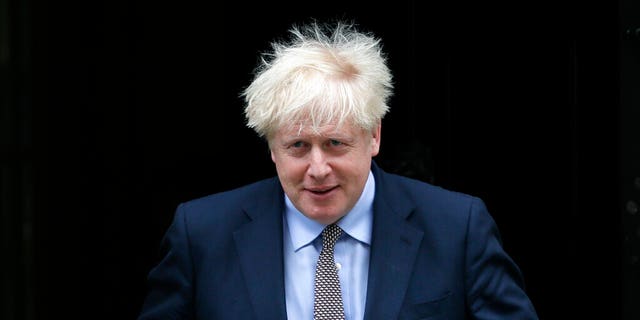 FILE - In this Wednesday, Sept. 9, 2020 file photo, Britain's Prime Minister Boris Johnson leaves Downing Street to attend the weekly session of Prime Ministers Questions in Parliament in London.  (AP Photo/Kirsty Wigglesworth, file)