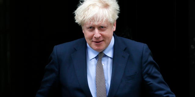 FILE - In this Wednesday, Sept. 9, 2020 file photo, Britain's Prime Minister Boris Johnson leaves Downing Street to attend the weekly session of Prime Ministers Questions in Parliament in London.  (AP Photo/Kirsty Wigglesworth, file)