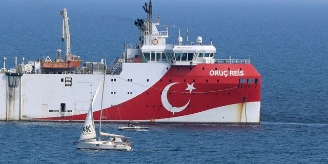 Turkey's research vessel, Oruc Reis anchored off the coast of Antalya on the Mediterranean, Turkey, Sunday, Sept. 13, 2020. Greece's Prime Minister Kyriakos Mitsotakis welcomed the return of a Turkish survey vessel to port Sunday from a disputed area of the eastern Mediterranean that has been at the heart of a summer stand-off between Greece and Turkey over energy rights. (AP Photo/Burhan Ozbilici)