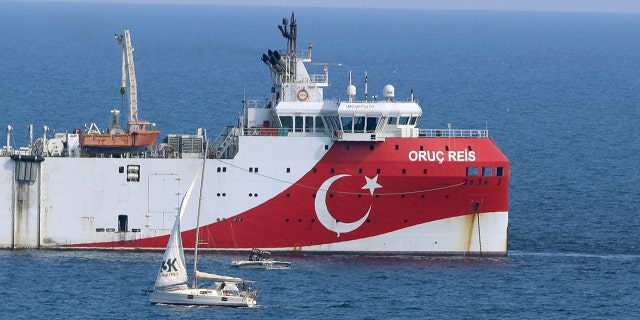 Turkey's research vessel, Oruc Reis anchored off the coast of Antalya on the Mediterranean, Turkey, Sunday, Sept. 13, 2020. Greece's Prime Minister Kyriakos Mitsotakis welcomed the return of a Turkish survey vessel to port Sunday from a disputed area of the eastern Mediterranean that has been at the heart of a summer stand-off between Greece and Turkey over energy rights. (AP Photo/Burhan Ozbilici)