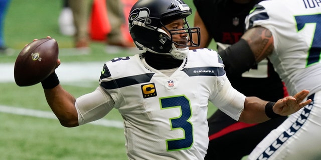 Seattle Seahawks quarterback Russell Wilson (3) works in the p[ocket against the Atlanta Falcons during the first half of an NFL football game, Sunday, Sept. 13, 2020, in Atlanta. (AP Photo/Brynn Anderson)