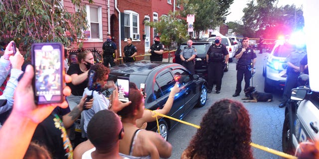 People chant during a protest at the scene of a police shooting on Laurel Street and Union Street in Lancaster city on Sunday, Sept. 13, 2020.