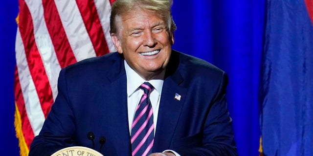 President Donald Trump smiles as gets cheers from the crowd as he arrives to participate in a Latinos for Trump Coalition roundtable Monday, Sept. 14, 2020, in Phoenix. (AP Photo/Ross D. Franklin)