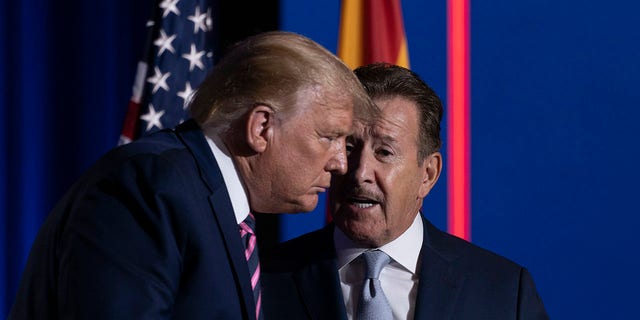 President Donald Trump speaks with Arte Moreno, owner of the Los Angeles Angels MLB baseball team, right, at the conclusion of a Latinos for Trump Coalition roundtable at Arizona Grand Resort &amp; Spa, Monday, Sept. 14, 2020, in Phoenix. (AP Photo/Andrew Harnik)