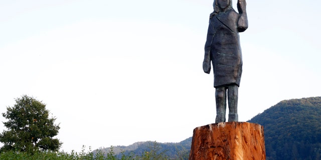 A bronze statue representing the U.S first lady Melania Trump made by Brad Downey, a Berlin-based U.S. artist, is erected in her birthplace of Sevnica, Slovenia, Tuesday, Sept. 15, 2020, after a previous one, made in wood, was set alight. Melania Trump was born and grew up in Slovenia before moving abroad as a fashion model. (AP Photo)