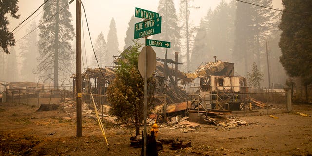 Land and property at an intersection is scorched, Sept. 15, in Blue River, Ore., eight days after the Holiday Farm Fire swept through the area's business district. More than 300 structures have been destroyed in the fire. (Andy Nelson/The Register-Guard via AP, Pool)