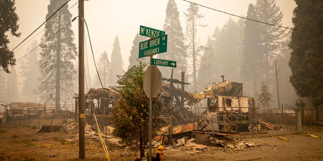 Land and property at an intersection is scorched, Sept. 15, in Blue River, Ore., eight days after the Holiday Farm Fire swept through the area's business district. More than 300 structures have been destroyed in the fire. (Andy Nelson/The Register-Guard via AP, Pool)