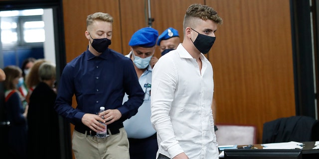 Gabriel Natale-Hjorth, right, and Finnegan Lee Elder, from California, arrive in court for a hearing in their trial where they are accused of slaying a plainclothes Carabinieri officer while on vacation in Italy last summer, in Rome, Wednesday, Sept. 16, 2020. (Remo Casilli/Pool Photo via AP)