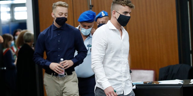 Gabriel Natale-Hjorth, right, and Finnegan Lee Elder, from California, arrive in court for a hearing in their trial where they are accused of slaying a plainclothes Carabinieri officer while on vacation in Italy last summer, in Rome, Wednesday, Sept. 16, 2020. (Remo Casilli/Pool Photo via AP)