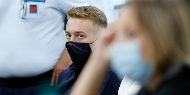 Finnegan Lee Elder, from California, looks on during a break in his trial where he and his friend Gabriel Natale-Hjorth are accused of slaying a plainclothes Carabinieri officer while on vacation in Italy last summer, in Rome, Wednesday, Sept. 16, 2020. (Remo Casilli/Pool Photo via AP)