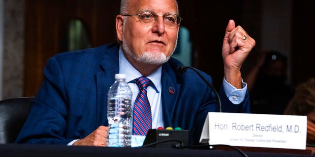 Dr Robert Redfield, director of the Centers for Disease Control and Prevention, highlighted his advocacy for in-person learning on Wednesday.  Here he is pictured testifying during a hearing with the Senate Appropriations Subcommittee on September 16, 2020 (Anna Moneymaker / New York Times, Pool via AP)