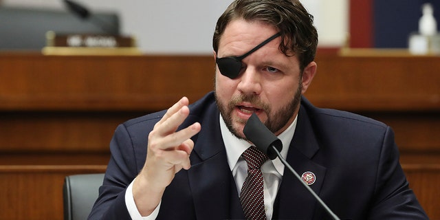 Rep. Dan Crenshaw, R-Texas, questions witnesses during a House Committee on Homeland Security hearing on 'worldwide threats to the homeland', Thursday, Sept. 17, 2020 on Capitol Hill Washington. (Chip Somodevilla/Pool via AP)