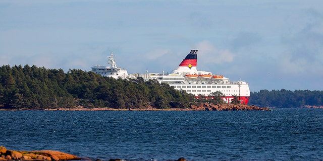 Viking Line's cruise ship M/S Amorella is seen near the Aland islands, seen from Finland, Sunday, Sept. 20, 2020. Finnish authorities say a Baltic Sea passenger ferry with nearly 300 people has run aground in the Aland Islands archipelago between Finland and Sweden without injuries. (Niclas Norlund/Lehtikuva via AP)