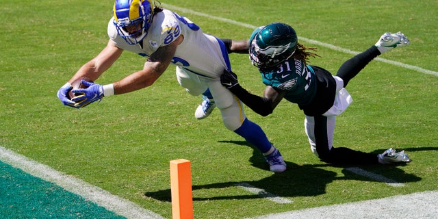 Los Angeles Rams' Tyler Higbee, left, reaches for a touchdown against Philadelphia Eagles' Nickell Robey-Coleman during the first half of an NFL football game, Sunday, Sept. 20, 2020, in Philadelphia. (AP Photo/Chris Szagola)