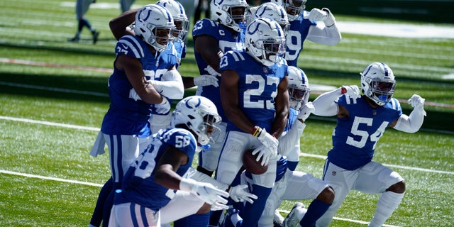 Indianapolis Colts' Kenny Moore II (23) celebrates an interception with teammates during the second half of an NFL football game against the Minnesota Vikings, Sunday, Sept. 20, 2020, in Indianapolis. (AP Photo/Michael Conroy)