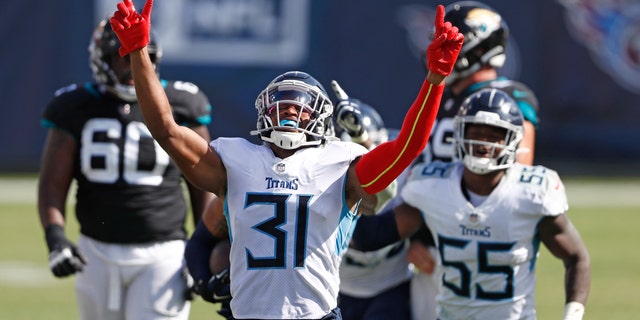 Tennessee Titans free safety Kevin Byard (31) celebrates after teammate Harold Landry intercepted a pass to stop the final drive of the Jacksonville Jaguars in the fourth quarter of an NFL football game Sunday, Sept. 20, 2020, in Nashville, Tenn. The Titans won 33-30.(AP Photo/Wade Payne)