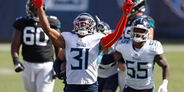 Tennessee Titans free safety Kevin Byard (31) celebrates after teammate Harold Landry intercepted a pass to stop the final drive of the Jacksonville Jaguars in the fourth quarter of an NFL football game Sunday, Sept. 20, 2020, in Nashville, Tenn. The Titans won 33-30.(AP Photo/Wade Payne)