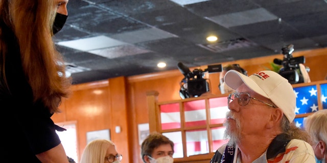 Republican congressional candidate and South Carolina state Rep. Nancy Mace, left, speaks with supporter Billy Paul, right, during a campaign event on Monday, Sept. 21, 2020, in North Charleston, S.C. (AP Photo/Meg Kinnard)