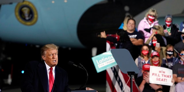President Donald Trump speaks during a campaign rally at Eugene F. Kranz Toledo Express Airport, Monday, Sept. 21, 2020, in Swanton, Ohio. (AP Photo/Alex Brandon)