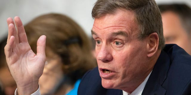 FILE - This Wednesday July 25, 2018 file photo shows Sen. Mark Warner, D-Va., vice-chair of the Senate Intelligence Committee, in Washington. Warner and Republican challenger Daniel Gade participated in a virtual debate in Northern Virginia earlier in the day. (AP Photo/J. Scott Applewhite)