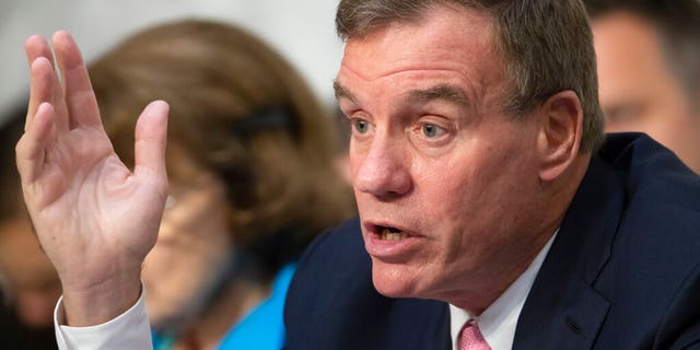 FILE - This Wednesday July 25, 2018 file photo shows Sen. Mark Warner, D-Va., vice-chair of the Senate Intelligence Committee, in Washington. Warner and Republican challenger Daniel Gade participated in a virtual debate in Northern Virginia earlier in the day.