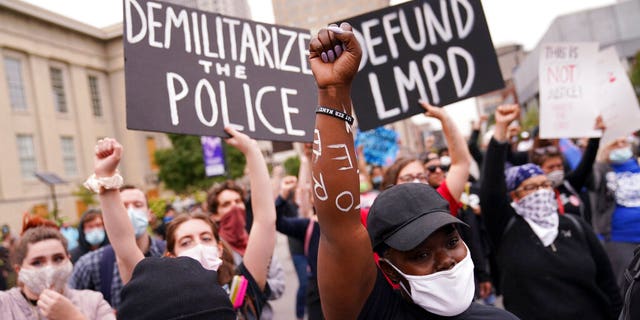 Protesters speak, Wednesday, Sept. 23, 2020, in Louisville, Ky. A grand jury has indicted one officer on criminal charges six months after Breonna Taylor was fatally shot by police in Kentucky. The jury presented its decision against fired officer Brett Hankison Wednesday to a judge in Louisville, where the shooting took place. (AP Photo/John Minchillo)
