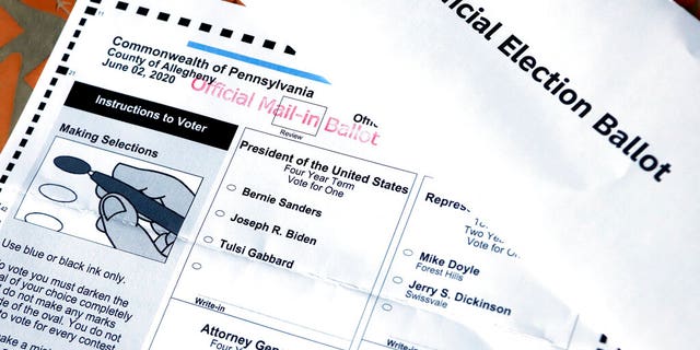 FILE: An Official Democratic General Primary mail-in ballot and secrecy envelope, for the Pennsylvania primary in Pittsburgh.