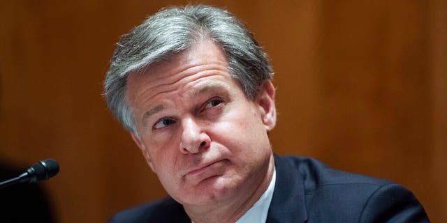 FBI Director Christopher Wray, testifies during a Senate Homeland Security and Governmental Affairs Committee hearing on "Threats to the Homeland" Thursday, Sept. 24, 2020 on Capitol Hill in Washington. 