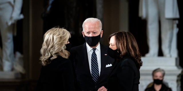 Democratic presidential candidate former Vice President Joe Biden and his wife Jill Biden, talk with Democratic vice presidential candidate Sen. Kamala Harris, D-Calif., before a ceremony to honor Justice Ruth Bader Ginsburg as she lies in state at National Statuary Hall in the U.S. Capitol on Friday, Sept. 25, 2020. Ginsburg died at the age of 87 on Sept. 18 and is the first women to lie in state at the Capitol. (Erin Schaff/The New York Times via AP, Pool)
