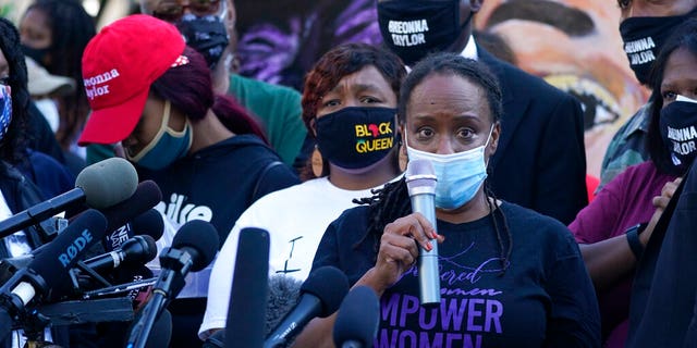 State Rep. Attica Scott speaks during a news conference, Friday, Sept. 25, 2020, in Louisville, Ky. (AP Photo/Darron Cummings)