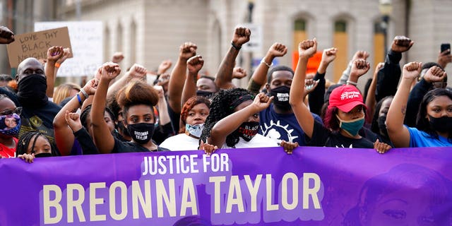 Black Lives Matter protesters march, Friday, Sept. 25, 2020, in Louisville. Breonna Taylor's family demanded Friday that Kentucky authorities release all body camera footage, police files and the transcripts of the grand jury hearings that led to no charges against police officers who killed the Black woman during a March drug raid at her apartment. (AP Photo/Darron Cummings)