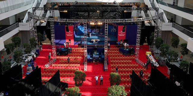 Preparations take place for the first presidential debate in the Sheila and Eric Samson Pavilion, Monday, Sept. 28, 2020, in Cleveland. The first debate between President Donald Trump and Democratic presidential candidate, former Vice President Joe Biden is scheduled to take place Tuesday, Sept. 29. (AP Photo/Patrick Semansky)