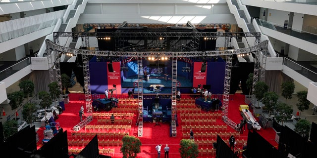 Preparations take place for the first presidential debate in the Sheila and Eric Samson Pavilion, Monday, Sept. 28, 2020, in Cleveland. The first debate between President Donald Trump and Democratic presidential candidate, former Vice President Joe Biden is scheduled to take place Tuesday, Sept. 29. (AP Photo/Patrick Semansky)