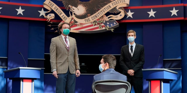 First presidential debate: What to watch for at the Trump vs. Biden showdown 2 Mock debaters stand onstage as preparations take place for the first Presidential debate in the Sheila and Eric Samson Pavilion, Monday, Sept. 28, 2020, in Cleveland. The first debate between President Donald Trump and Democratic presidential candidate, former Vice President Joe Biden is scheduled to take place Tuesday, Sept. 29. (AP Photo/Patrick Semansky)