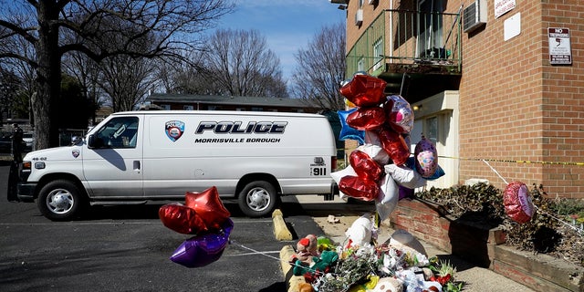 A makeshift memorial is seen outside the Robert Morris Apartments in Morrisville, Pa. Shana Decree, 47, and Dominique Decree, 21, were sentenced in Bucks County Court after entering guilty but mentally ill pleas to five counts of first-degree murder. (AP Photo/Matt Slocum, File)