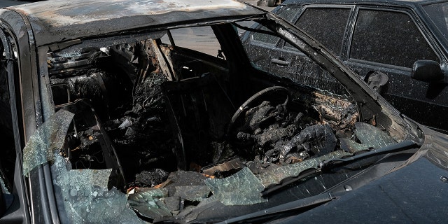 A car destroyed by shelling in Stepanakert, the self-proclaimed Republic of Nagorno-Karabakh, Azerbaijan, Tuesday, Sept. 29, 2020. Armenian and Azerbaijani forces accused each other of attacks on their territory Tuesday, as fighting over the separatist region of Nagorno-Karabakh continued for a third straight day following the reigniting of a decades-old conflict. (Areg Balayan/PAN Photo via AP)