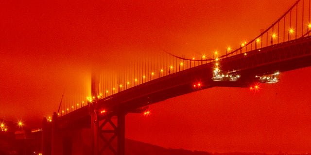 The Golden Gate Bridge is pictured on Wednesday morning in San Francisco, amid a smoky, orange hue caused by the ongoing wildfires. (Frederic Larson via AP)