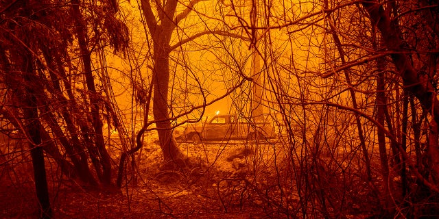 A scorched car rests in a clearing following the Bear Fire in Butte County, Calif., on Wednesday, Sept. 9, 2020.