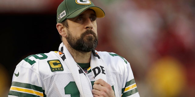 In this Jan. 19, 2020, file photo, Green Bay Packers quarterback Aaron Rodgers (12) watches from the sideline during the first half of the NFL NFC Championship football game against the San Francisco 49ers in Santa Clara, Calif. The Green Bay Packers are counting on consistency to get them over the top after finishing a game away from the Super Bowl three of the last six years. (AP Photo/Ben Margot, File)