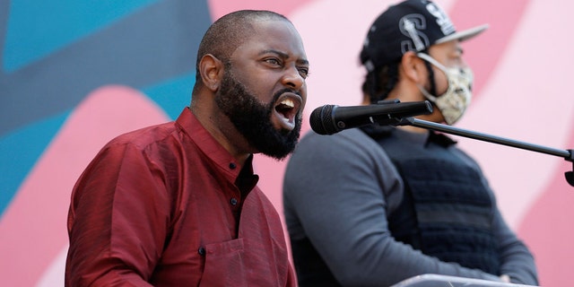 Community activist Andre Taylor, whose brother Che Taylor was fatally shot by police in 2016, speaks to the crowd during a community gathering remembering George Floyd, Breonna Taylor and Ahmaud Arbery at First African Methodist Episcopal Church in Seattle, Washington, U.S. June 1, 2020. REUTERS/Lindsey Wasson